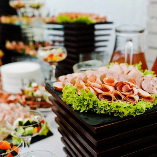 Buffet table of reception with burgers, cold snacks, meat and salads